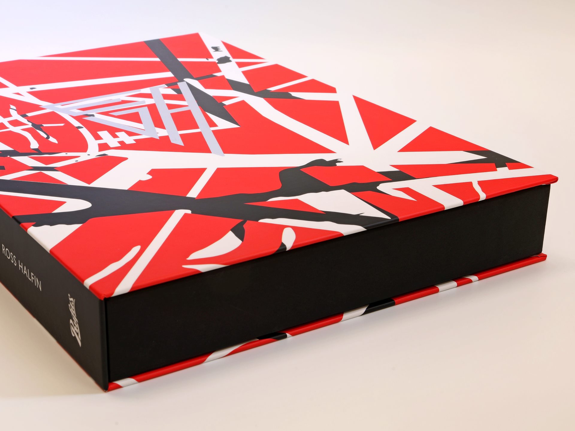Clamshell box striking red, white and black pattern with foil blocking