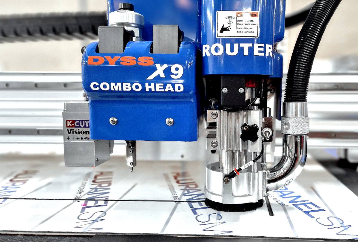 Close-up of the DYSS X9 digital cutting system cutting rigid printed material at Duraweld.