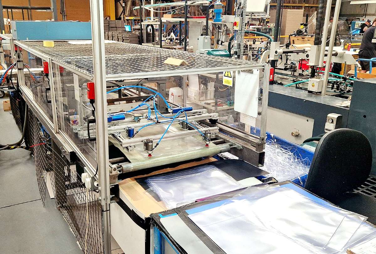 Inline high-frequency welding machine producing clear PVC document wallets at Duraweld.