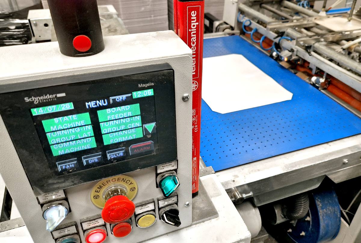 Control panel and board feeder on a Samed Darix Turbo paper over board case-making machine.