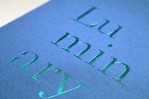 Metallic foil blocking on a textured presentation cover